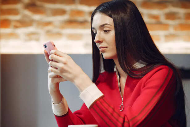 Person Looking at Multiple Dating Notifications