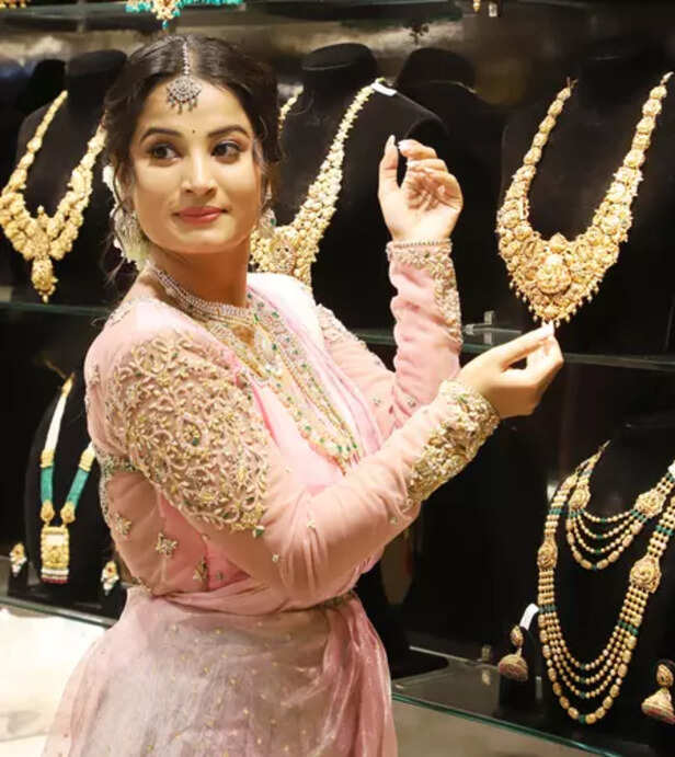 Gold, silver prices ease on MCX amid profit booking at record highs