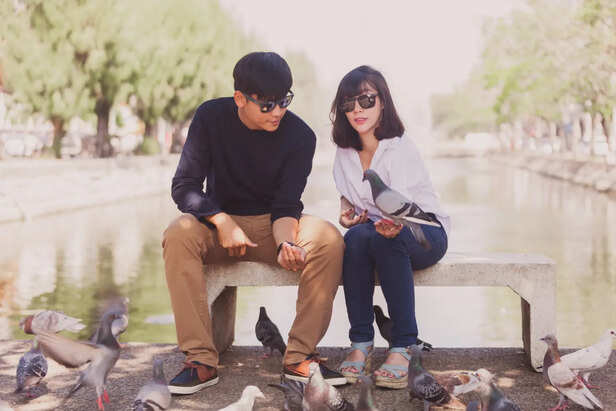 Two People Sitting Apart