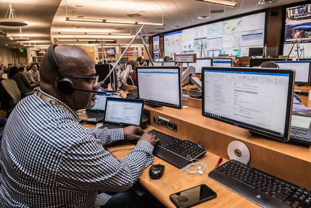 Engineers Monitoring AI Systems in a Control Room