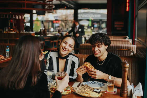 Friends Enjoying a Meal in a Restaurant