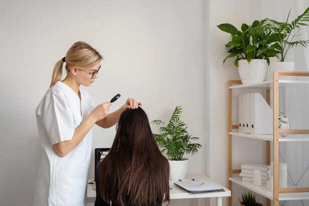 Hair Specialist Examining Scalp Health