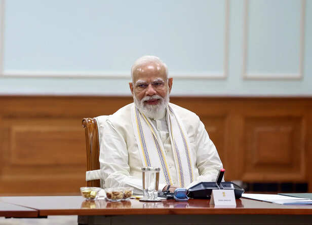 Prime Minister Narendra Modi chairs a meeting with memb...
