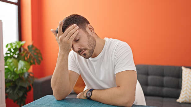 Woman struggling to lift one arm