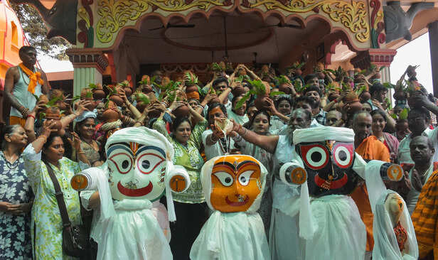 People perform rituals during the Snana Yatra of Lord Jagan...