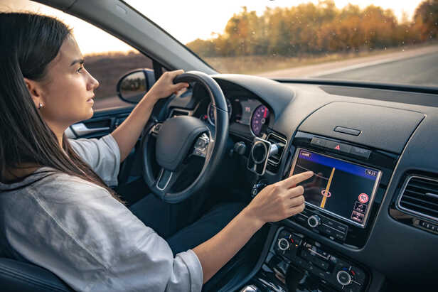 Driver Using Modern Car Touchscreen