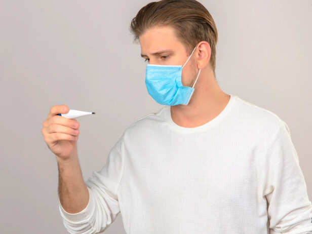 Person Checking Temperature During Flu