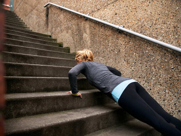 Woman struggling to breathe after climbing stairs
