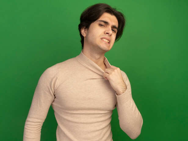 Man experiencing wheezing while breathing