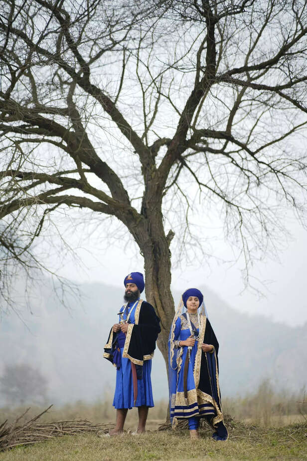 turban wearing man and wo