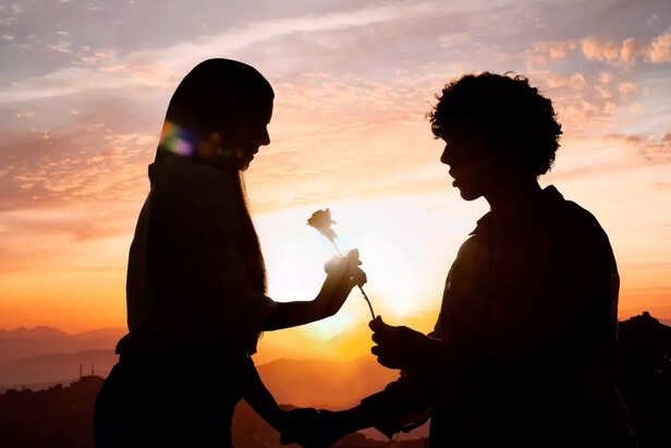 A guy giving a flower