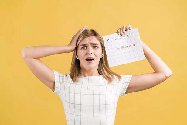 "Confused Woman Holding M
