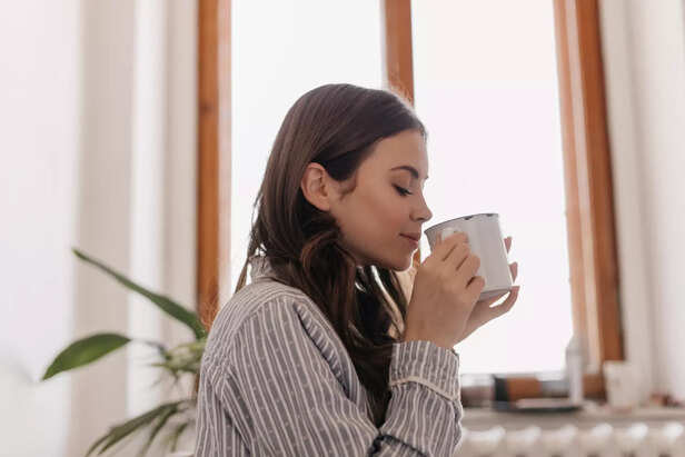 Woman sipping coffee